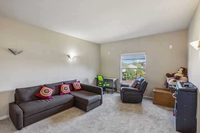 living room with carpet and baseboards