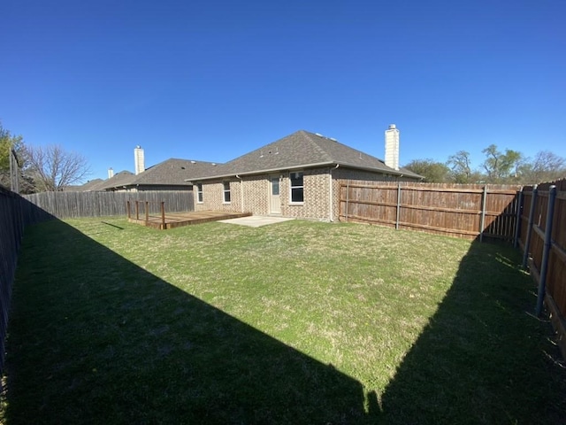 view of yard with a fenced backyard