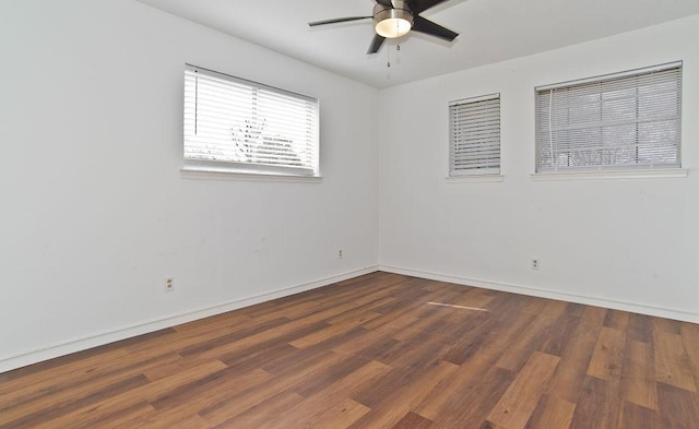 unfurnished room featuring ceiling fan, baseboards, and wood finished floors