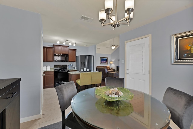 dining area with ceiling fan with notable chandelier, visible vents, baseboards, and light tile patterned flooring