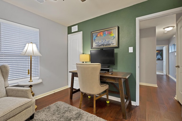 office featuring wood finished floors, visible vents, and baseboards