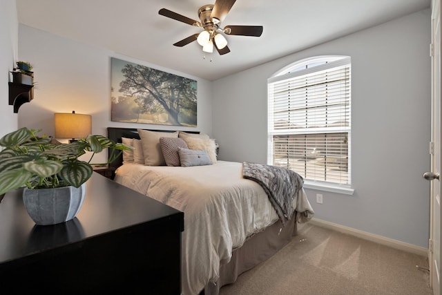 bedroom featuring carpet flooring, a ceiling fan, and baseboards