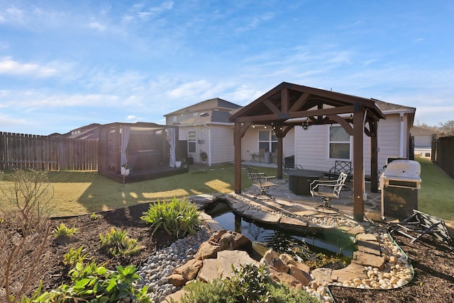 view of yard with a patio area, a fenced backyard, and a gazebo