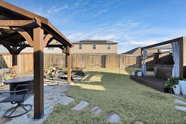 view of yard featuring a patio area, a fenced backyard, and a wooden deck