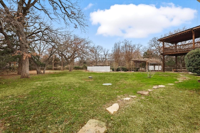 view of yard with a wooden deck