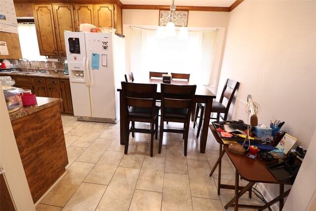 8418 W Wilderness Way, Shreveport, LA 71106 - dining space with a notable chandelier, ornamental molding, and light tile patterned floors