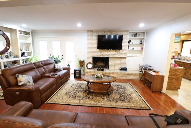 8418 W Wilderness Way, Shreveport, LA 71106 - living area featuring recessed lighting, ornamental molding, built in features, a fireplace, and wood finished floors