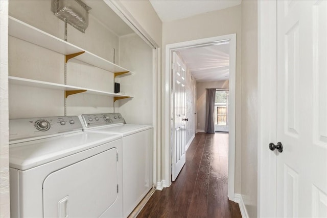 laundry room with washer and dryer, baseboards, and dark wood-style floors