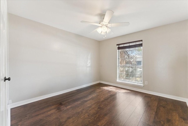 unfurnished room featuring baseboards, ceiling fan, and dark wood-style flooring