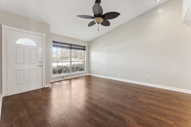 entryway with baseboards, lofted ceiling, wood finished floors, and a ceiling fan