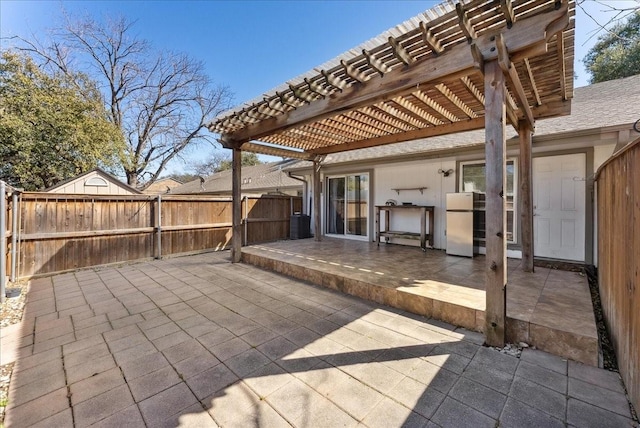 view of patio with fence, a pergola, and central AC