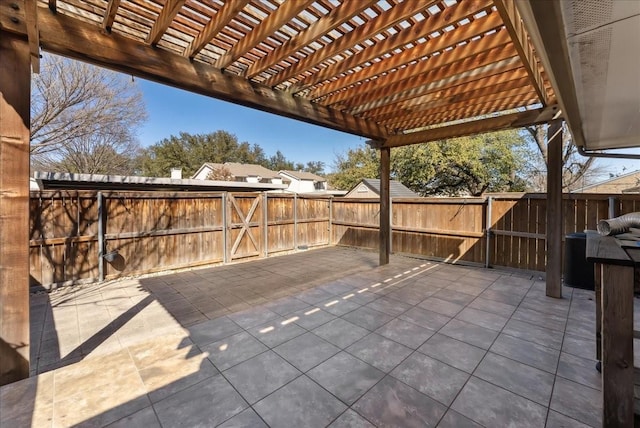 view of patio featuring fence, a pergola, and a gate