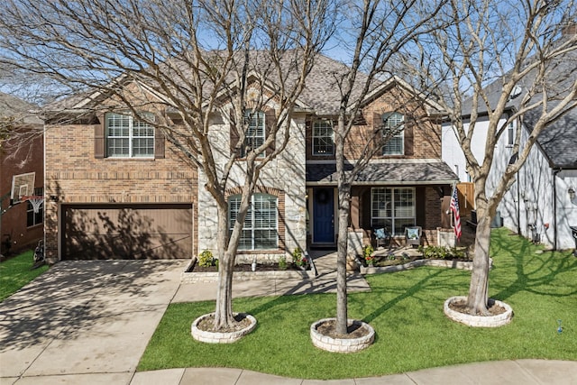 view of front of home with concrete driveway, an attached garage, a front lawn, a porch, and brick siding