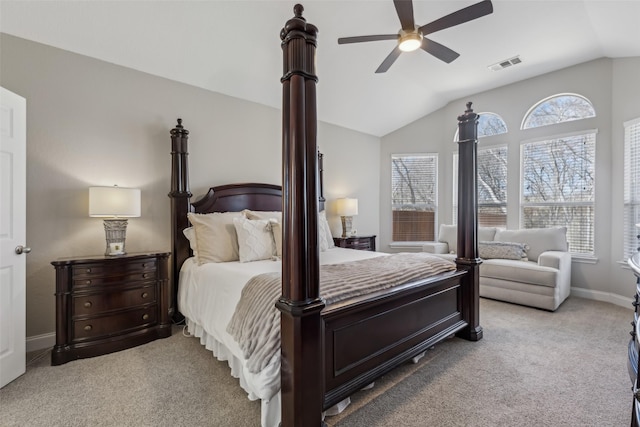 carpeted bedroom featuring lofted ceiling, baseboards, visible vents, and ceiling fan