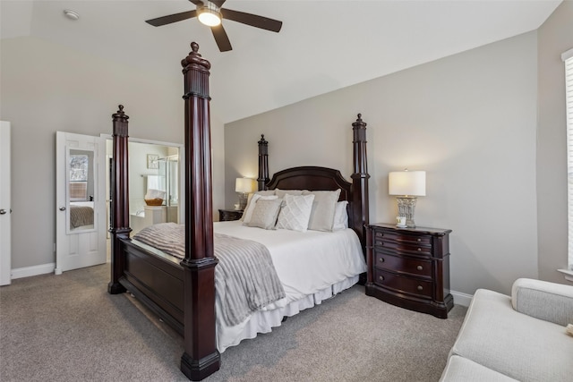 carpeted bedroom featuring lofted ceiling, baseboards, and a ceiling fan