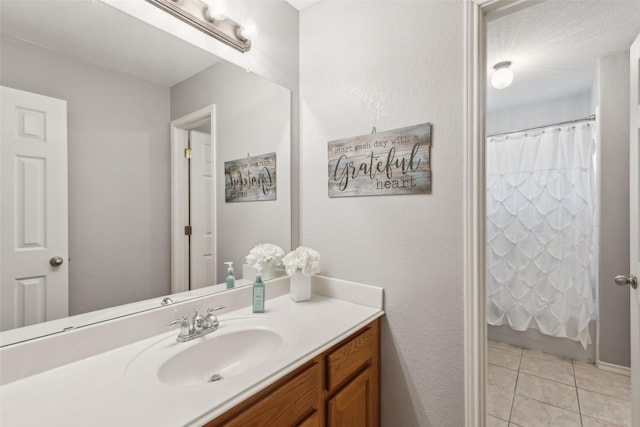 full bath featuring tile patterned flooring and vanity