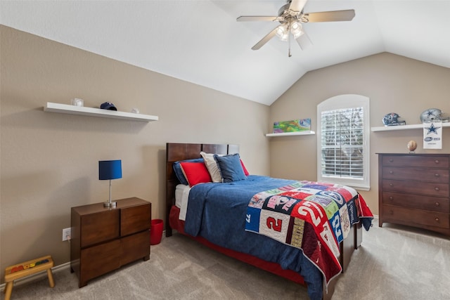 carpeted bedroom with vaulted ceiling and ceiling fan