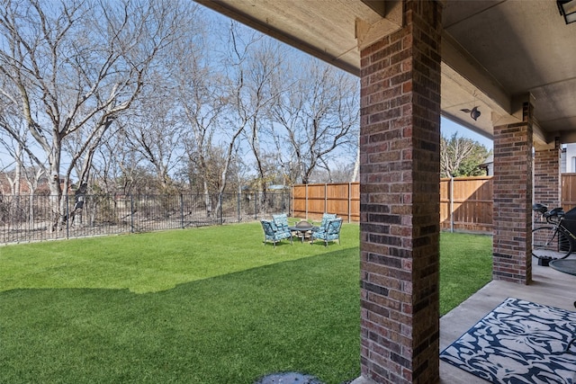 view of yard featuring a patio area and a fenced backyard