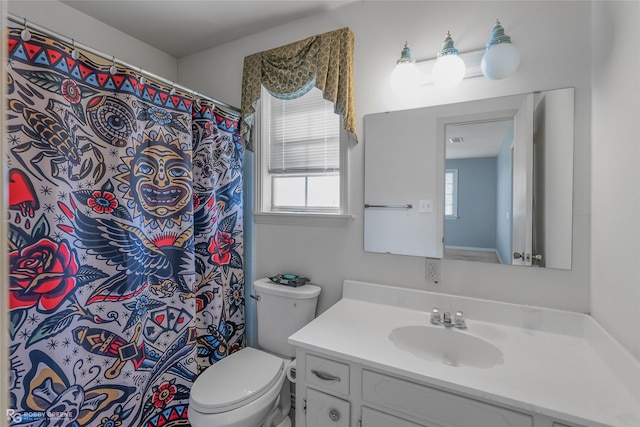 bathroom with toilet and vanity