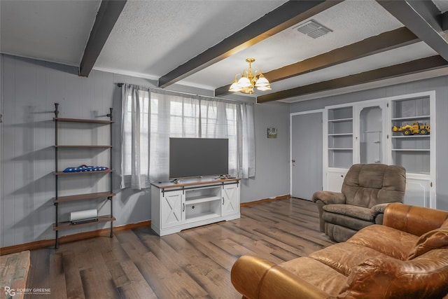 living room with arched walkways, visible vents, wood finished floors, a chandelier, and beamed ceiling