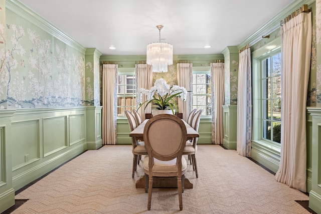 carpeted dining room featuring a chandelier, recessed lighting, a decorative wall, wainscoting, and wallpapered walls