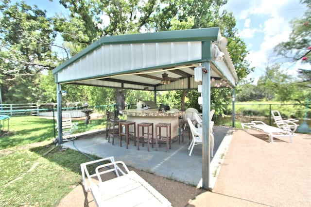 1579 County Road 2008 Unit F, Glen Rose, TX 76043 - view of home's community featuring a patio, fence, outdoor wet bar, exterior kitchen, and a yard