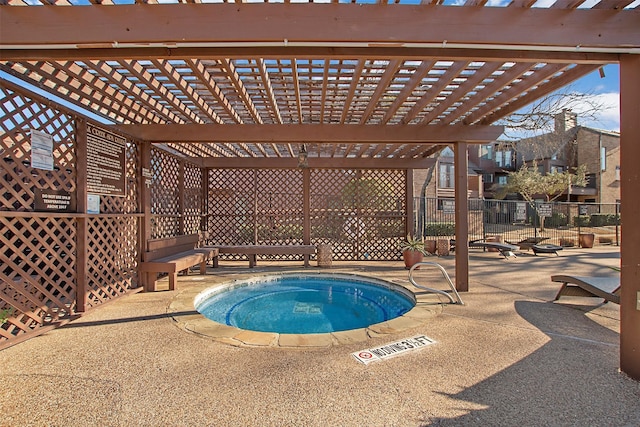 view of swimming pool with a hot tub, fence, a pergola, and a patio