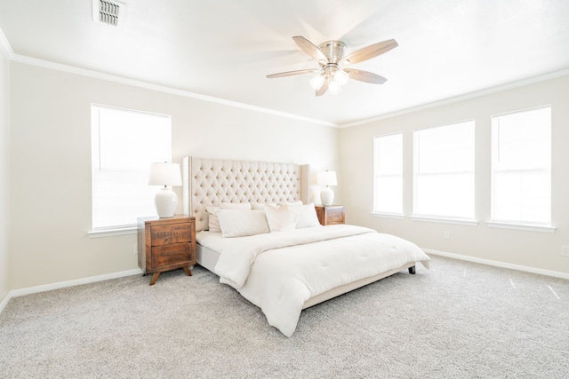 bedroom with ornamental molding, carpet, visible vents, and baseboards