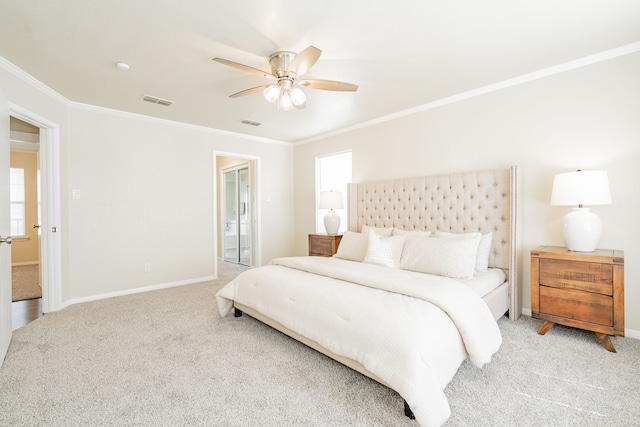 bedroom featuring ornamental molding, baseboards, visible vents, and carpet flooring