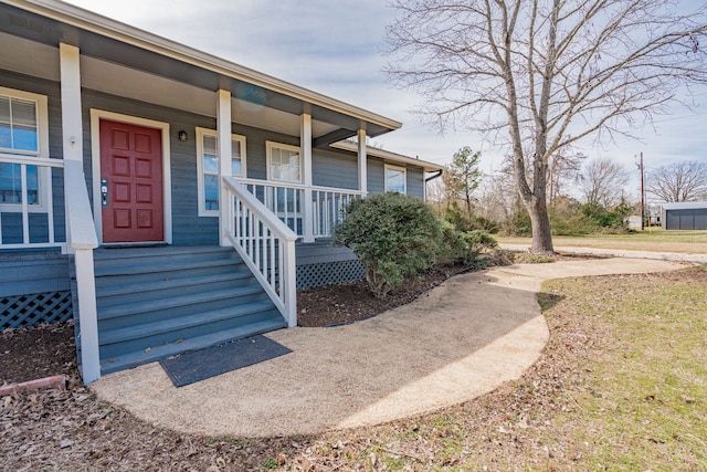 property entrance featuring covered porch