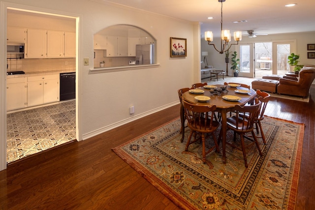 dining room featuring dark wood-style floors, recessed lighting, ornamental molding, a chandelier, and baseboards