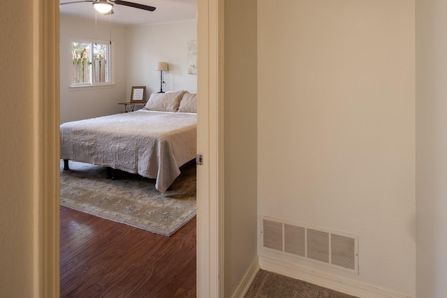 932 Troup Hwy, Tyler, TX 75701 - bedroom with wood finished floors, a ceiling fan, and crown molding