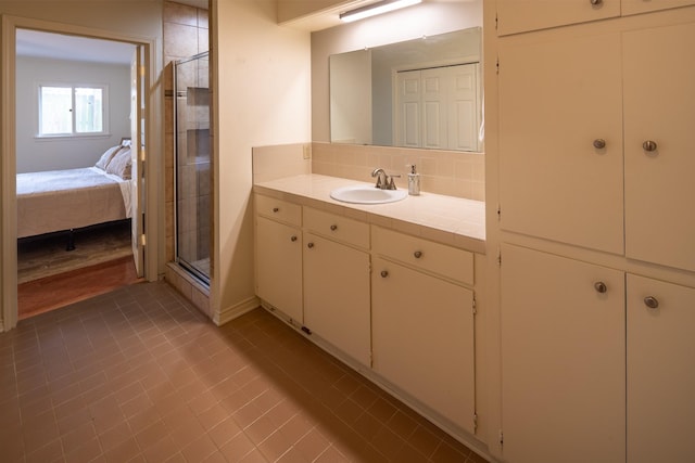 full bath featuring ensuite bath, a shower stall, backsplash, and vanity