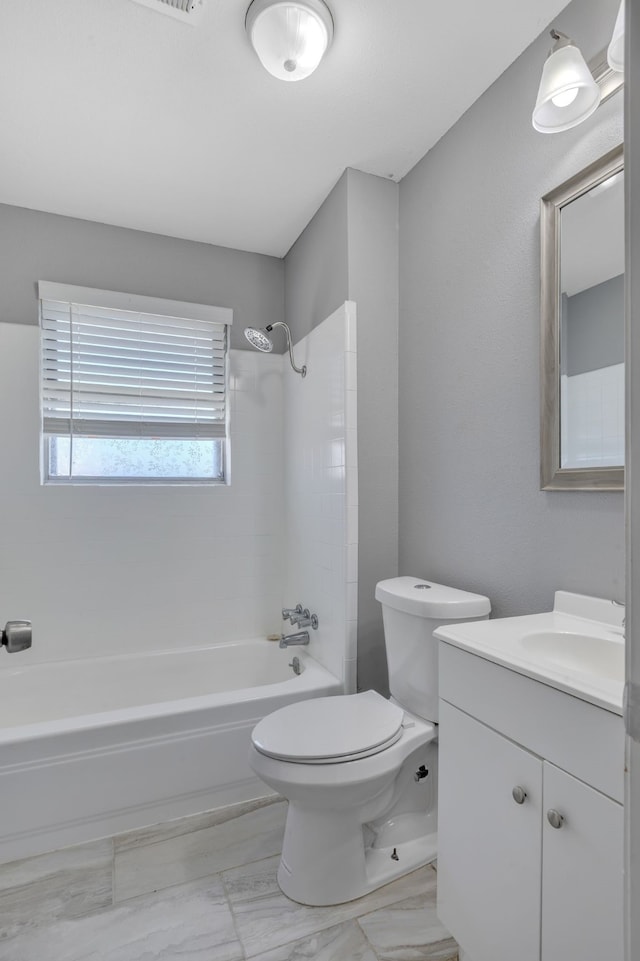 full bathroom with bathtub / shower combination, vanity, toilet, and marble finish floor