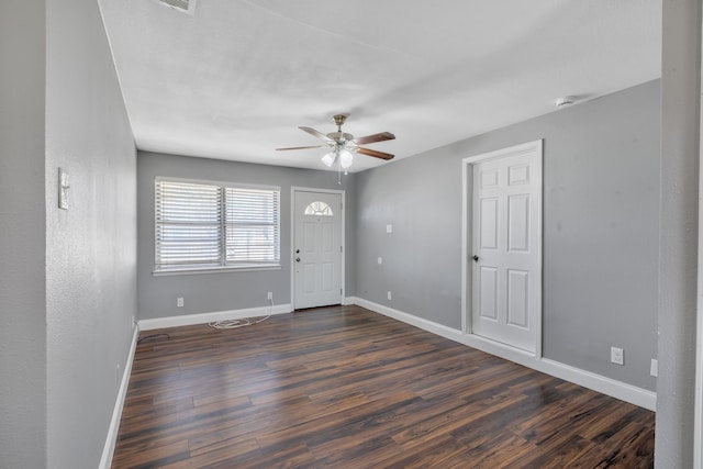 entrance foyer with dark wood-style floors, ceiling fan, and baseboards