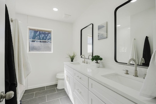 full bath featuring tile patterned flooring, a sink, and a wealth of natural light