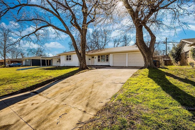 single story home featuring concrete driveway, an attached garage, and a front lawn