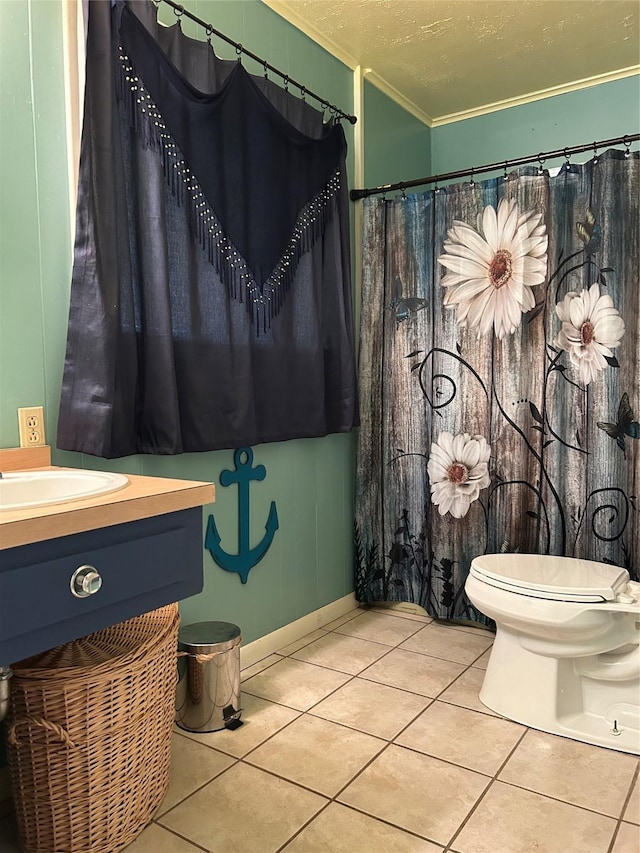 full bath with tile patterned flooring, ornamental molding, a textured ceiling, and vanity