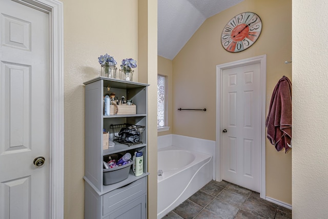 full bath with vaulted ceiling and a bath