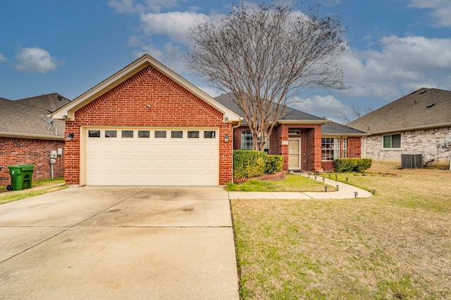 ranch-style home featuring central AC unit, a garage, brick siding, concrete driveway, and a front yard