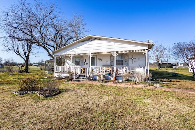 view of front of house featuring a porch and a front yard