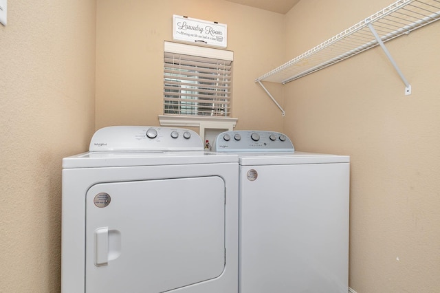 washroom with laundry area and independent washer and dryer