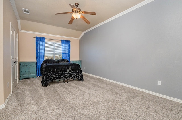 carpeted bedroom with lofted ceiling, a ceiling fan, visible vents, baseboards, and ornamental molding