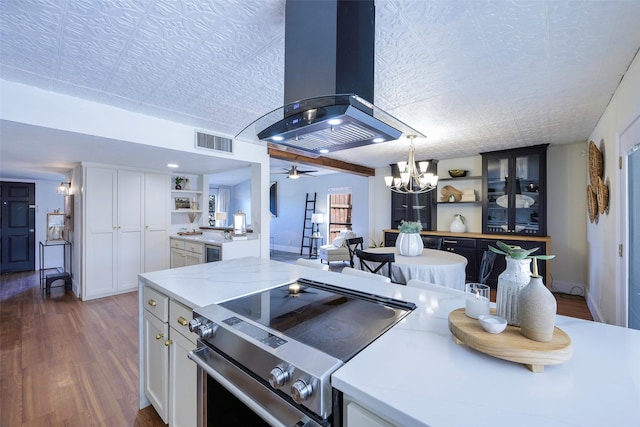 kitchen featuring visible vents, island exhaust hood, open shelves, white cabinetry, and stainless steel range with electric cooktop