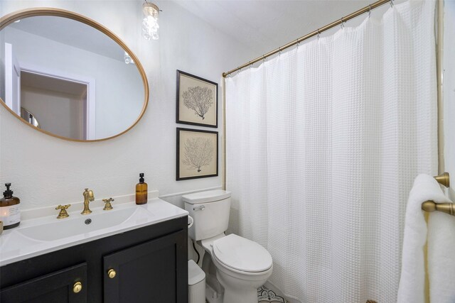 full bathroom with vanity and toilet