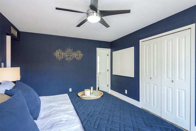 bedroom featuring a closet, a ceiling fan, and baseboards