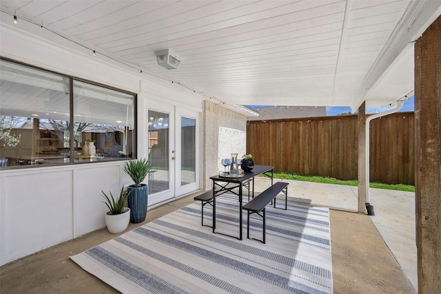 view of patio / terrace with french doors and fence