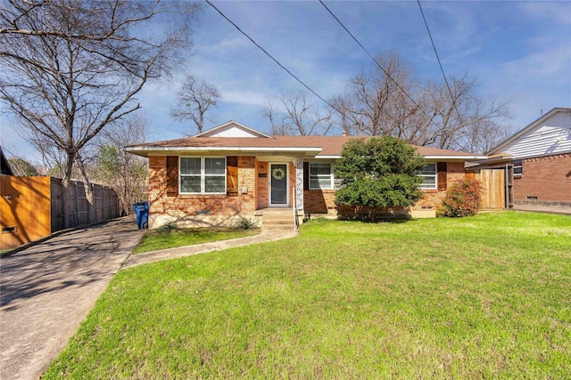 view of front facade featuring brick siding, concrete driveway, crawl space, fence, and a front yard