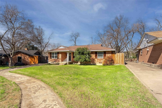 ranch-style home featuring crawl space, fence, a front lawn, and brick siding