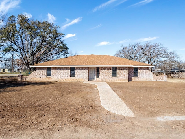 view of front facade featuring brick siding